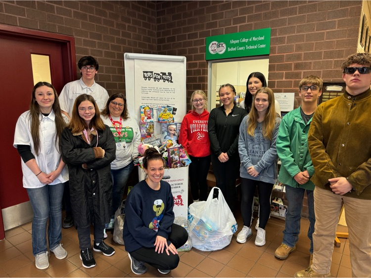 SkillsUSA officers with Toys for Tots Representatives turning over our donations.